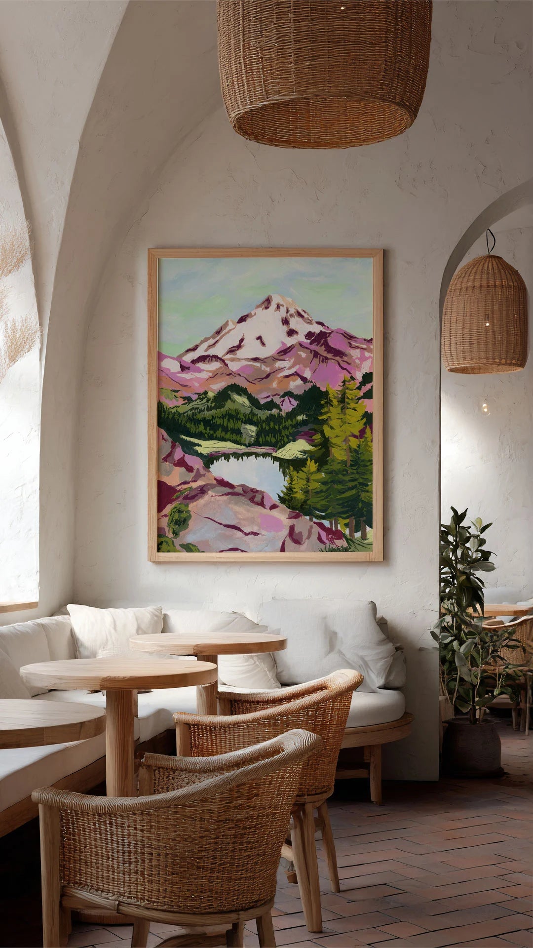 Restaurant interior with a canvas painting of a mountain on the wall