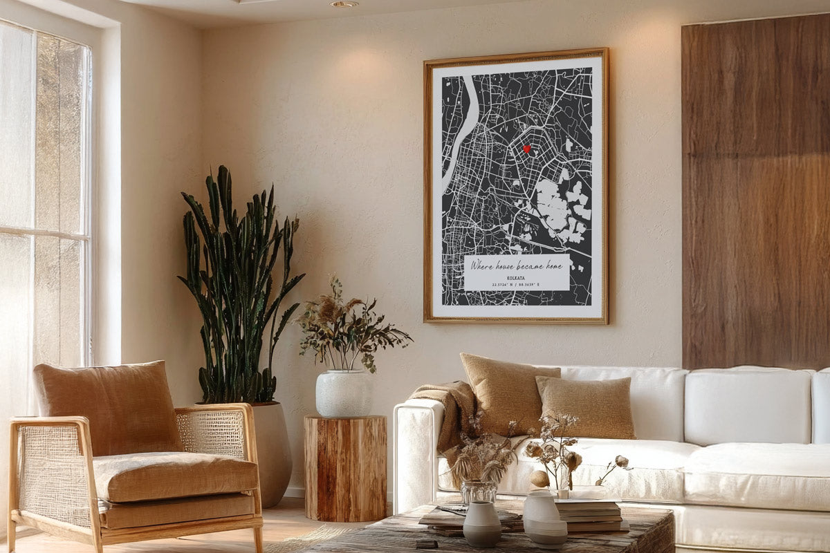 Living room with a white sofa, brown armchair, and framed map on the wall.